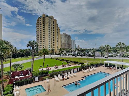 a view of a resort with two pools and a building at Grand Caribbean Perdido Key #306 West in Perdido Key