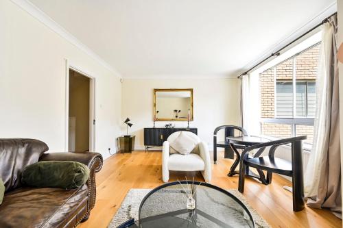 a living room with a couch and a table at bloomrooms@Knightsbridge/HydePark in London