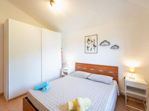 a bedroom with a bed with blue towels on it at Holiday Home Pilar by Interhome in Strada
