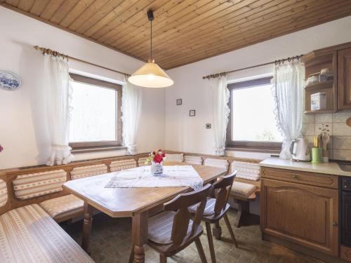 a kitchen with a table and chairs in a room at Holiday Home Landhaus Rittisweid by Interhome in Schladming
