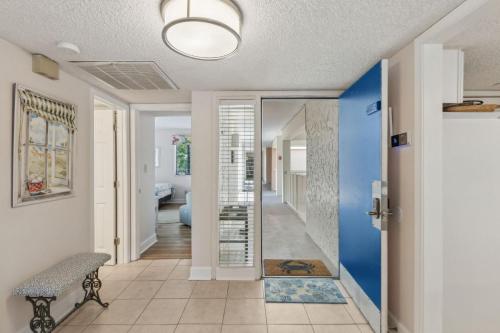 a hallway of a home with a blue wall at 2034 Beachwood in Fernandina Beach