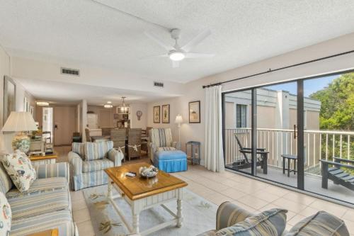 a living room with a couch and a table at 2034 Beachwood in Fernandina Beach
