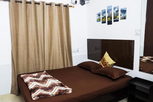 a bedroom with a large bed with a curtain at Bollywood House 100 inch Cinema Jacuzzi Party Couples in Gurgaon