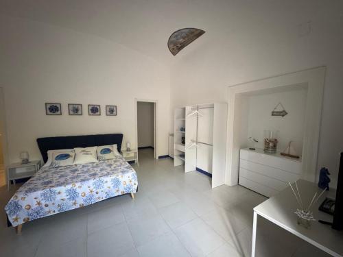 Ένα ή περισσότερα κρεβάτια σε δωμάτιο στο Maison Vittoria