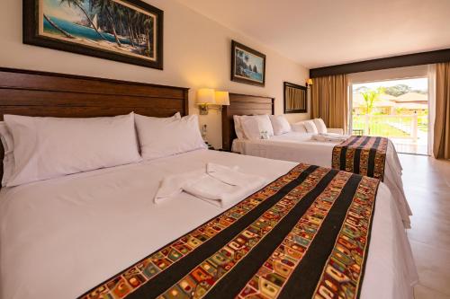 Postel nebo postele na pokoji v ubytování Bella Terra Laguna Azul Resort & Spa