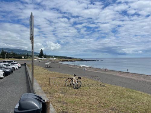 a bike parked on the side of a beach at Toes in the sand in São Roque