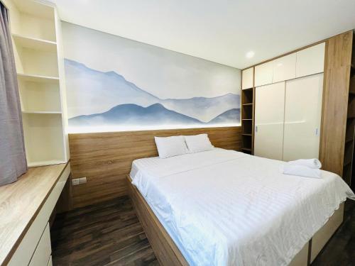Postel nebo postele na pokoji v ubytování Ha Đo Centrosa Building , Ba Thang Hai street, distrist 10