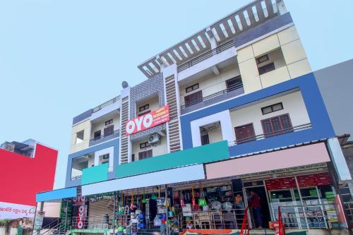 a building with a store in front of it at Hotel O HAPPY RESIDENCY in Bībīnagar