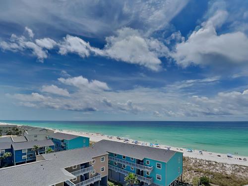 a view of the beach from the balcony of a resort at Regency Towers #802 East in Pensacola Beach