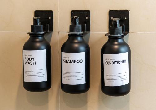 a group of three bottles of medicine on a wall at Cicerón 612 Aparthotel Polanco in Mexico City