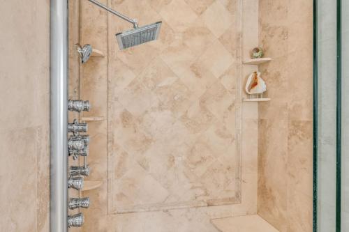 a shower in a bathroom with a glass door at Sailfish Point - Luxury Waterfront Pool Home, 80' Dock in Key Colony Beach