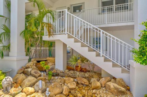 a staircase in a house with rocks and trees at Sailfish Point - Luxury Waterfront Pool Home, 80' Dock in Key Colony Beach