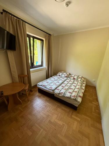 Postel nebo postele na pokoji v ubytování Zacisze
