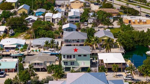 an aerial view of a residential neighborhood with houses at Tipsy Turtle - Waterfront Pool Home, Direct Atlantic Access! in Marathon