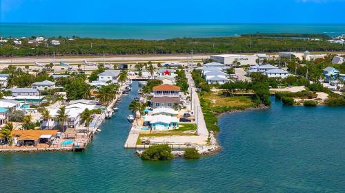 an aerial view of a resort in the water at Tipsy Turtle - Waterfront Pool Home, Direct Atlantic Access! in Marathon