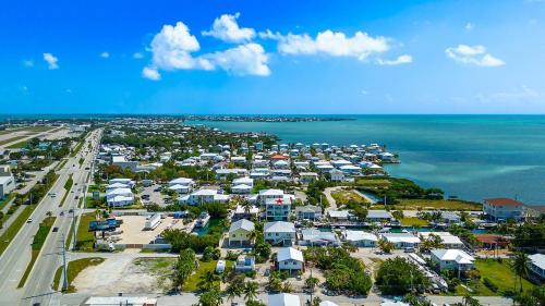 an aerial view of a parking lot next to the ocean at Tipsy Turtle - Waterfront Pool Home, Direct Atlantic Access! in Marathon