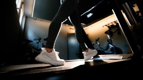 a person walking on a treadmill in a gym at Destinar Apart in Carilo