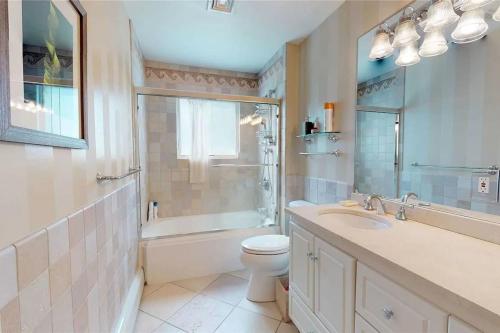 a bathroom with a toilet and a sink and a shower at 572) Large 3 bedroom with a gorgeous pool 