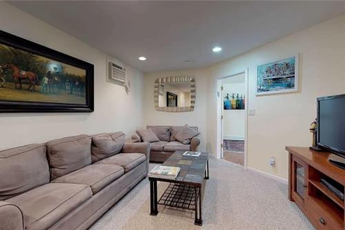 a living room with a couch and a tv at 572) Large 3 bedroom with a gorgeous pool 