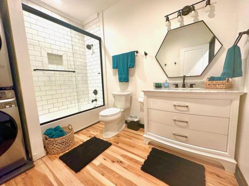 a bathroom with a sink and a toilet and a mirror at HOUSE OF ROCK - DOWNTOWN, RUPP ARENA, KEENELAND, HORSE PARK in Lexington