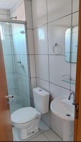 a bathroom with a toilet and a sink at Apartamento cop 30 ainda será mobiliado in Ananindeua