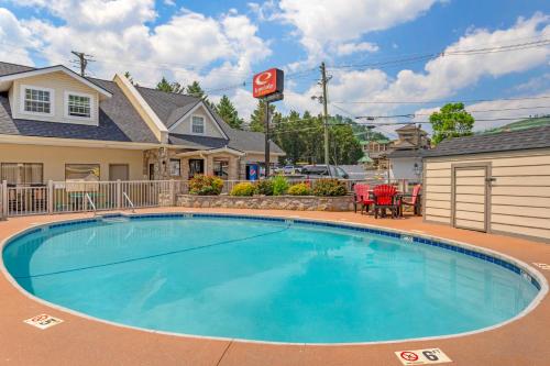 a swimming pool in front of a house at Econo Lodge Inn & Suites Gatlinburg at the Convention Center in Gatlinburg