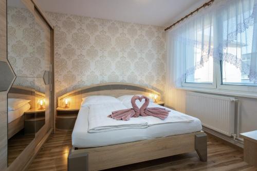 Кровать или кровати в номере Penzion Blesk