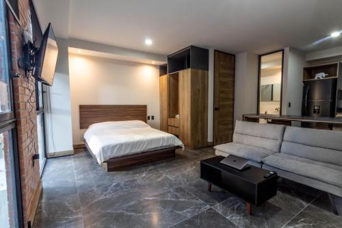 Ένα ή περισσότερα κρεβάτια σε δωμάτιο στο LOFT en Americana Torre con alberca, Gym, Pet fr