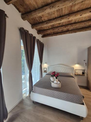 a bedroom with a bed with flowers on it at Villa Joy Verona - Junior Suite in Verona