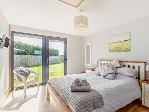 a bedroom with a bed with two towels on it at 1 Bed in Launceston 50217 in Virginstow