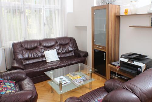 
a living room filled with furniture and a tv at Prague-1 Hostel in Prague

