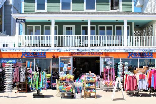 a clothing store in front of a building at Hampton Tides-Ocean View-Top Floor With Balcony in Hampton
