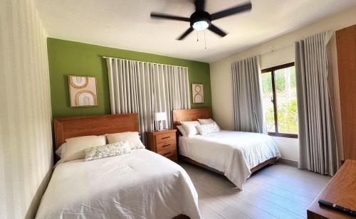 Кровать или кровати в номере Vista del Campo Country Club & Villas