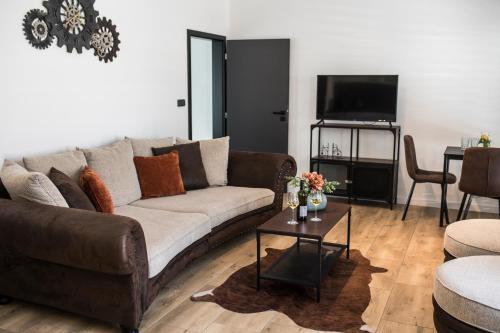 a living room with a couch and a table at M.F. in Znojmo