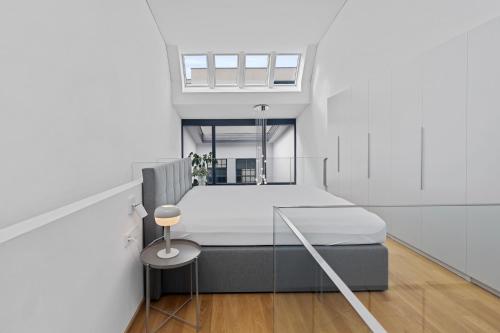 Postel nebo postele na pokoji v ubytování Bodensee Loft in Strandnähe