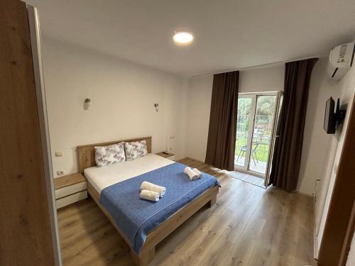 Postel nebo postele na pokoji v ubytování Markovi Apartments