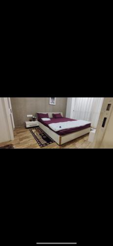 a bedroom with a large bed in a room at Rajhans belliza in Surat