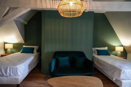 En eller flere senge i et værelse på Le Clos de St Val 6