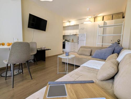 a living room with a couch and a table at Cozy apartment on Sunny Beach in Sunny Beach