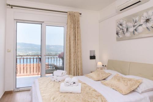 Postel nebo postele na pokoji v ubytování Apartmani Gaby
