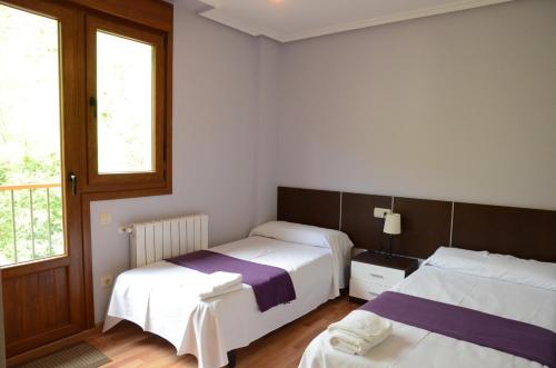 Postel nebo postele na pokoji v ubytování Apartamentos el Rincon de Limes