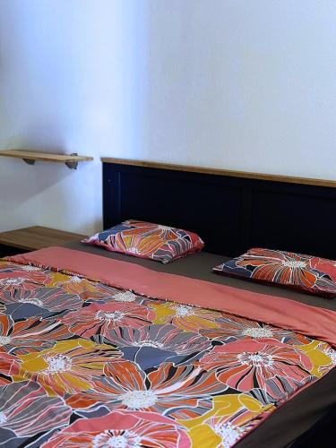 a bed with two pillows on it in a bedroom at Island house MARTA in Koločep