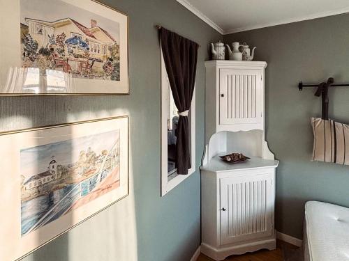 a bedroom with a bed and a picture on the wall at 4 star holiday home in VARBERG-By Traum in Varberg