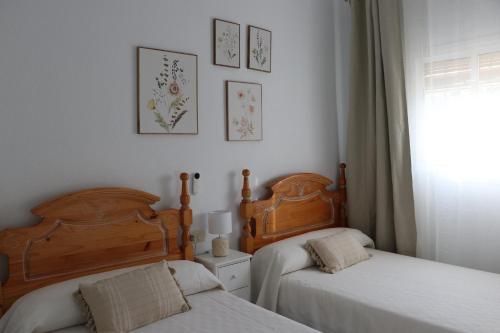 a bedroom with two beds and a window at Villa Calatrue - Tabernas in Tabernas
