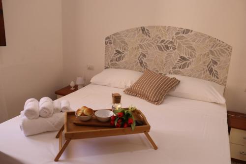 Ένα ή περισσότερα κρεβάτια σε δωμάτιο στο Casaelbaferie