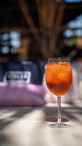 a drink in a glass sitting on a table at Castillete Hotel & Beach Club in Tierra Bomba