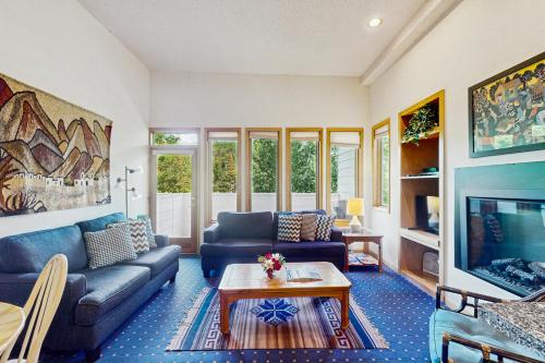 a living room with a couch and a table at Sun Vail E in Vail