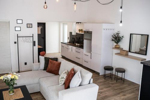 a living room with a couch and a kitchen at MFapartments in Vrbovec