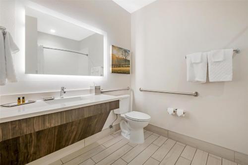 a white bathroom with a sink and a toilet at Best Western Plus Elizabethtown Inn & Suites in Elizabethtown