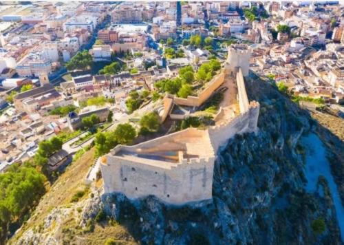 an aerial view of a castle on a hill at EL CHORRO Aire acondicionado Bar privado Barbacoa Amplios patios in Castalla